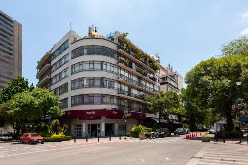 a building on a street with cars parked in front of it at Casa Itzae B&B Polanquito Dog Friendly in Mexico City