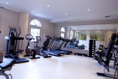 a gym with treadmills and ellipticals in a room at The Royal Crescent Hotel & Spa in Bath