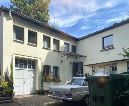 an old car parked in front of a house at Traumhaftes Privatzimmer in Karlsruhe in Karlsruhe