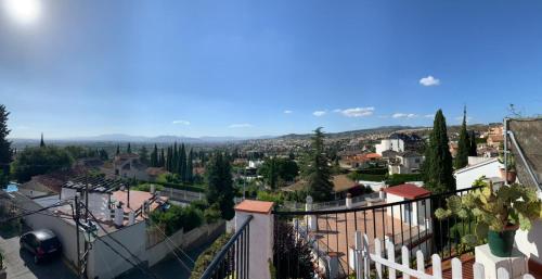 a view of a city from a balcony of a town at Casa al-andalus in Granada