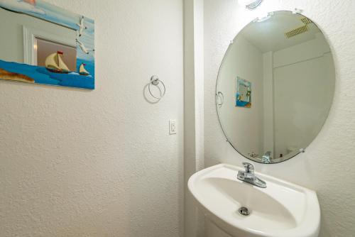 a bathroom with a sink and a mirror at Ocean View's in Kill Devil Hills
