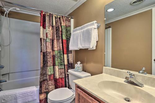 a bathroom with a sink and a toilet and a shower at Condo with Pool and Grill Access about 4 Mi to Gatlinburg! in Gatlinburg