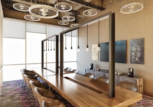 a dining room with a long table and chairs at Novotel Mexico City Toreo in Mexico City
