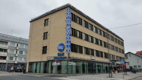
a large building with a sign on the side of it at Best Western Hotel Apollo in Oulu
