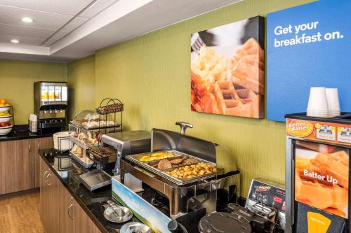 a fast food restaurant with a counter with food at Comfort Inn Airport in Winnipeg