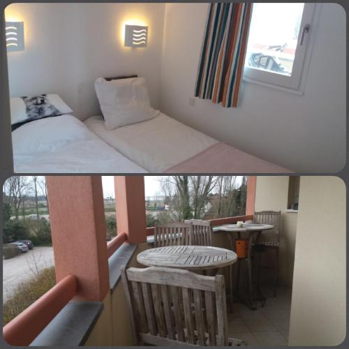 une chambre avec un lit, une table et une fenêtre dans l'établissement Dans la résidence les jardins d opale, à Le Touquet-Paris-Plage