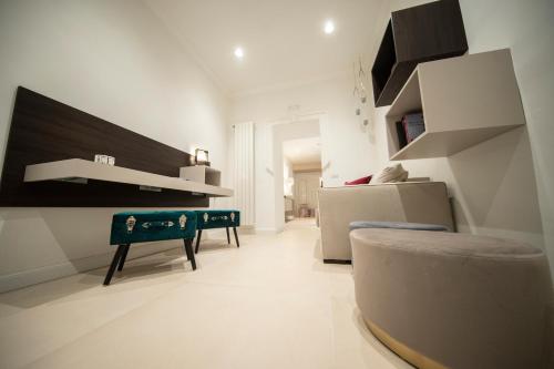 a living room with a table and a couch at BARI 102 in Bari