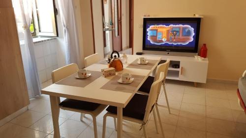 A television and/or entertainment centre at BALCONI SU TROPEA