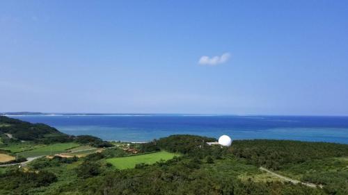 an observatory on top of a hill near the ocean at Kume Azuma Villa in Kumejima