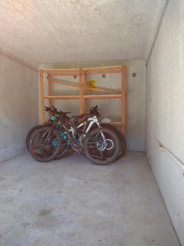 a motorcycle is parked in a garage at Hotel Garni Forsthaus Ruhpolding in Ruhpolding