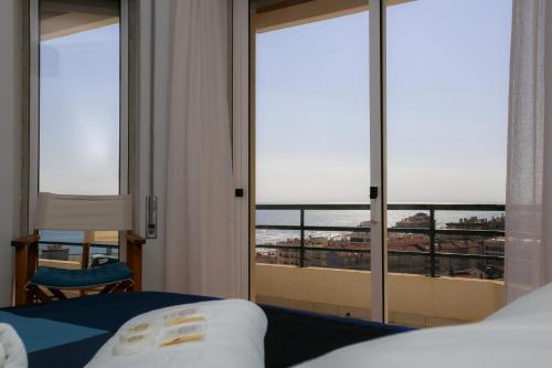 Ένα ή περισσότερα κρεβάτια σε δωμάτιο στο Buarcos Pool Apartment