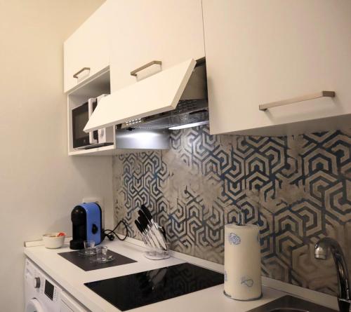 a kitchen with a sink and a counter top at La finestra "sul Lago" in Predore