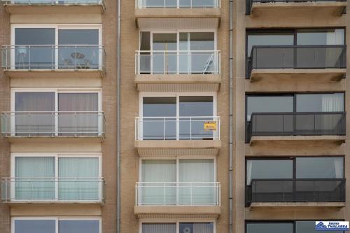 a facade of an apartment building with balconies at Golvenzang 0401 in Koksijde