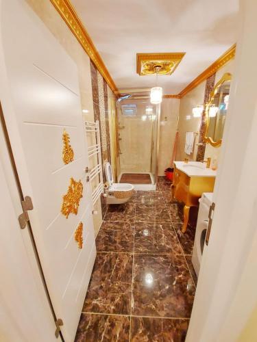 a bathroom with a shower and a toilet and a sink at seasidehouse in Ordu