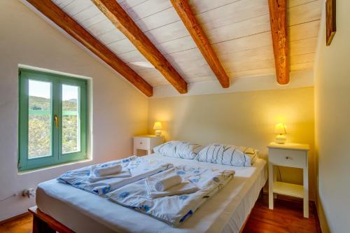מיטה או מיטות בחדר ב-Holiday home Oliva