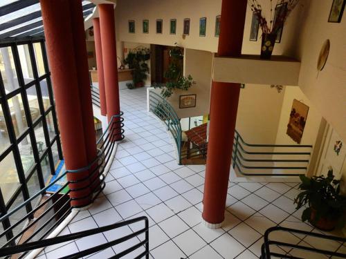 a large building with a stairway leading up to it at Hotel Viar in Cabezón de la Sal