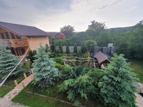 an aerial view of a garden with trees and a house at Daiana Residence Turda in Turda