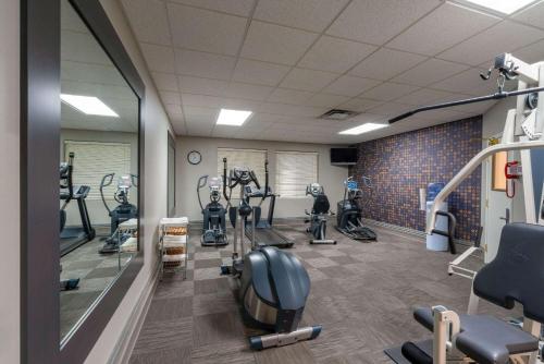 a gym with several treadmills and elliptical machines at La Quinta by Wyndham Rifle in Rifle