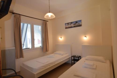 Кровать или кровати в номере Jimmy's Apartments