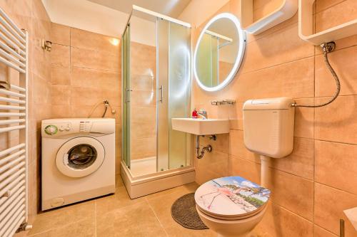 a bathroom with a shower toilet and a sink at Apartments Marija Pula in Pula