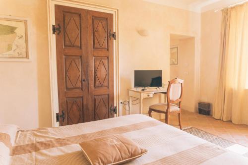 Letto o letti in una camera di Hotel Relais Il Borgo