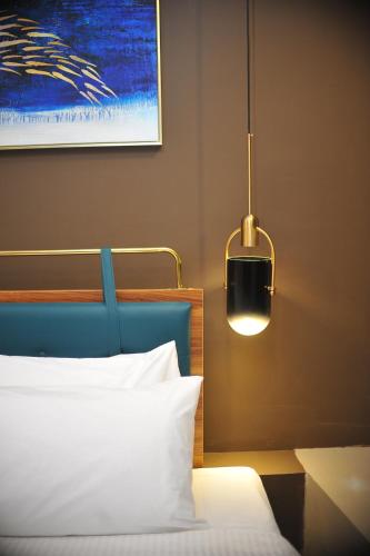 Ένα ή περισσότερα κρεβάτια σε δωμάτιο στο Skye Hotel Sunway