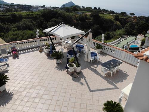 an aerial view of a patio with tables and chairs at Villa Natalina in Ischia
