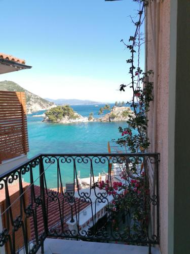 a balcony with a view of the ocean at Avra in Parga