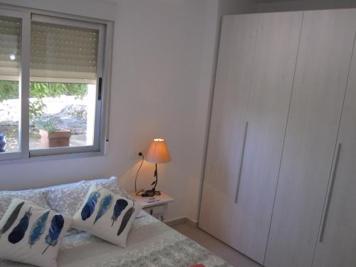 Ένα ή περισσότερα κρεβάτια σε δωμάτιο στο Villa Elvira apartamento
