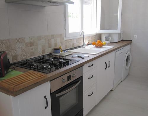 Η κουζίνα ή μικρή κουζίνα στο Villa Elvira apartamento