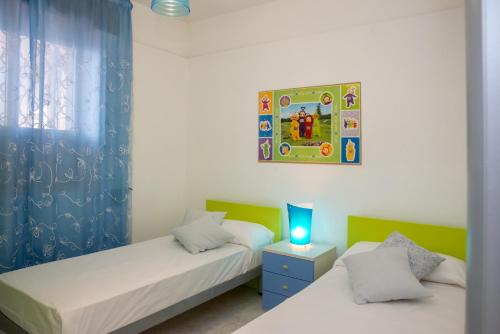 Giường trong phòng chung tại Free Parking - Villa MiSa a 2 passi dal mare