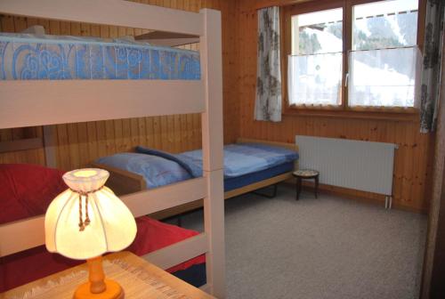 Postel nebo postele na pokoji v ubytování Ferienwohnung Bürchen