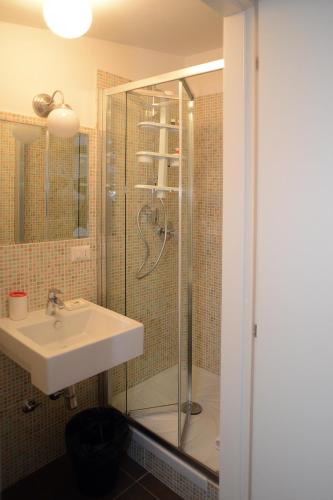 a bathroom with a sink and a shower at B&B Thule in Caltanissetta
