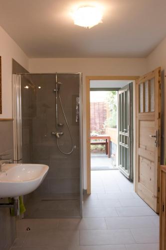 a bathroom with a shower and a sink at dresden-ferien haus in Dresden
