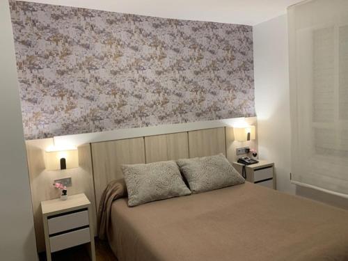 Postel nebo postele na pokoji v ubytování Hotel Herreros