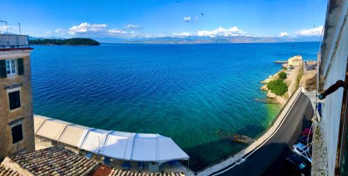 a view of a large body of water from a building at Lighthouse apartment in Corfu Town