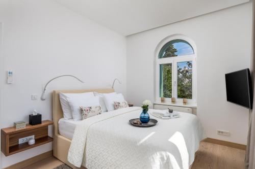 Säng eller sängar i ett rum på OLA Opatija Luxury Apartments