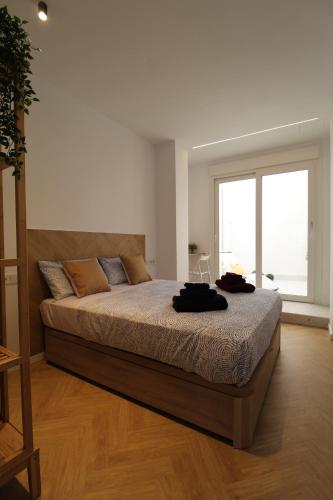 A bed or beds in a room at Encanto en el centro de Alicante