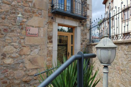 a street light in front of a building with a door at HOTEL RURAL EL DENARIO in Garray