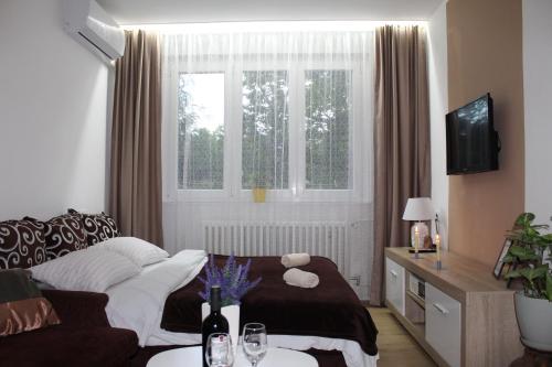 Ένα ή περισσότερα κρεβάτια σε δωμάτιο στο Apartman LUNI