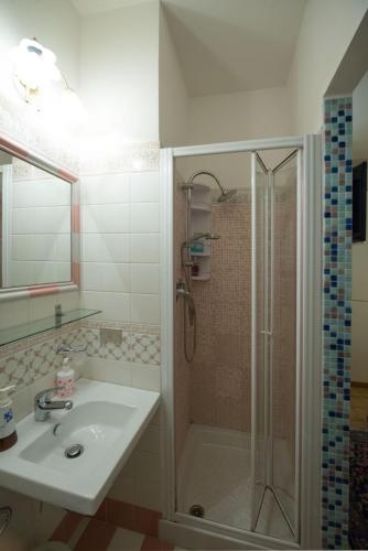 a bathroom with a sink and a shower at B&B Casa Cettina in Macerata