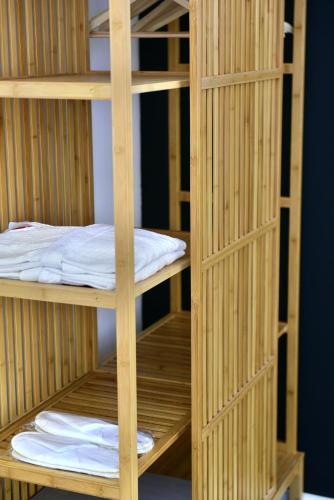 a set of wooden bunk beds in a room at Hydra Icons in Hydra