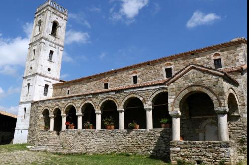 an old stone building with a clock tower at Hotel Fieri in Fier
