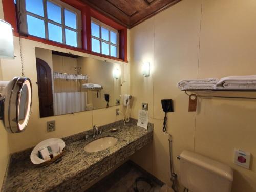 Ett badrum på Hotel Pousada do Arcanjo
