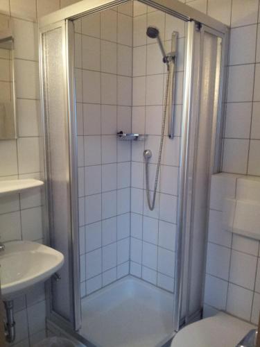 a bathroom with a shower and a sink at Zur frischen Quelle in Oberasbach