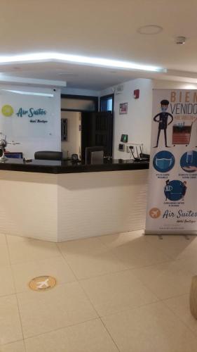 a kitchen with a counter with a sign on it at Air Suites Hotel Boutique in Quito