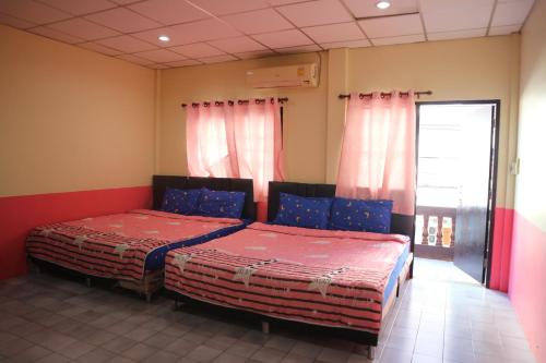 Tempat tidur dalam kamar di Sam Resort Chaam