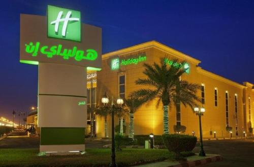 a us cellular building with a sign in front of it at Holiday Inn Al Khobar by IHG in Al Khobar