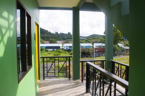 a balcony with a view of a train at N&N HOUSE Laem Hin in Ban Laem Hin