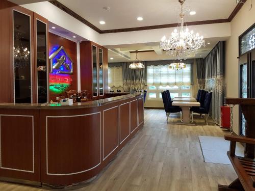 a large lobby with a bar and a dining area at Loving kinmen Homestay in Jincheng